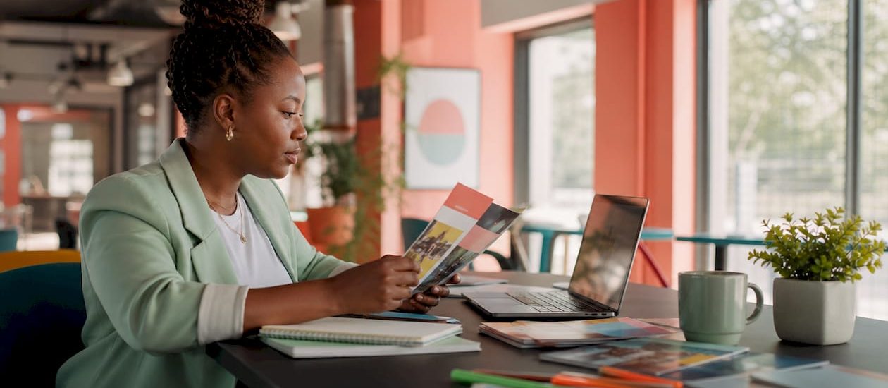 Woman coordinating direct mail and digital campaigns